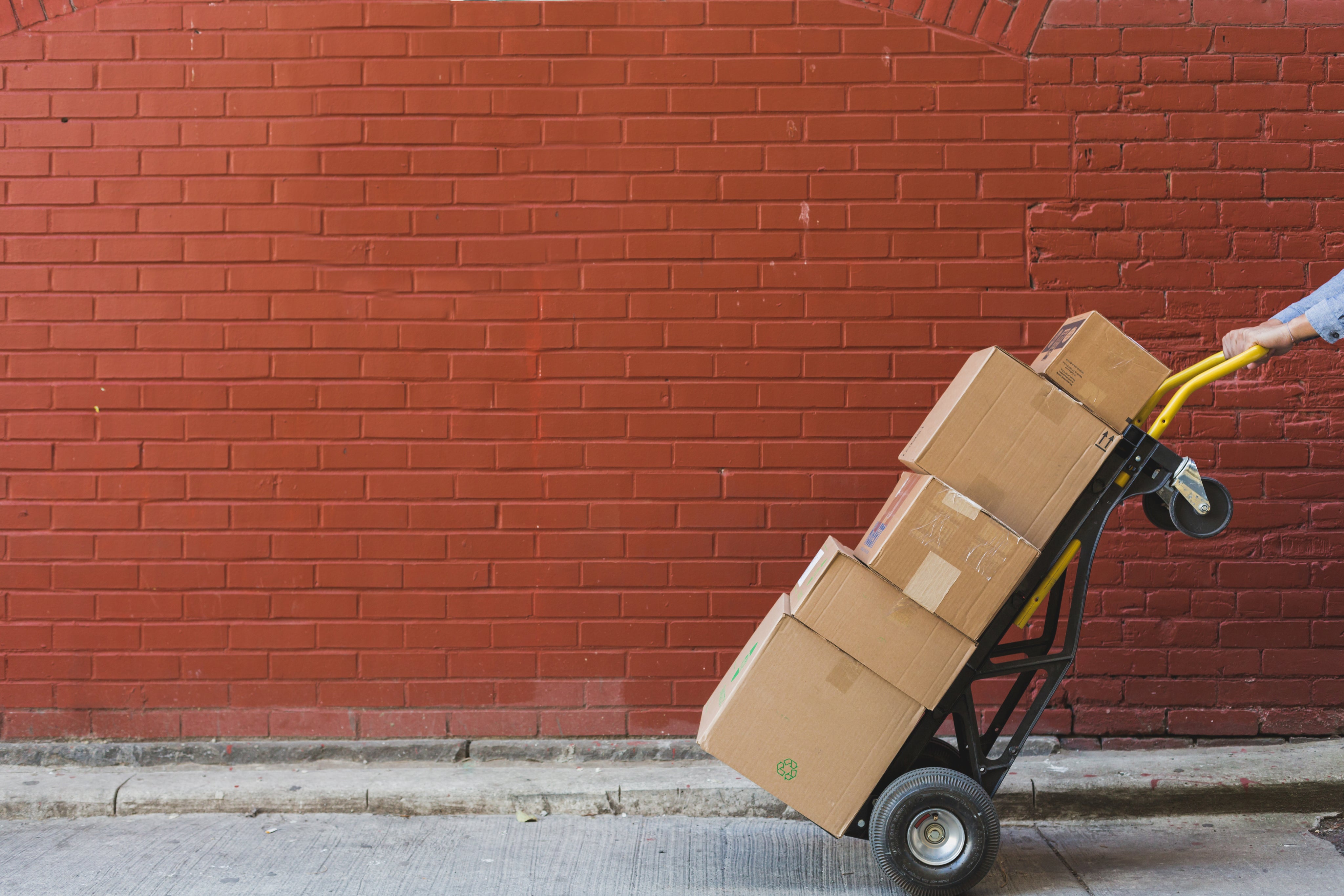 shipping-boxes-in-front-of-red-brick.jpg